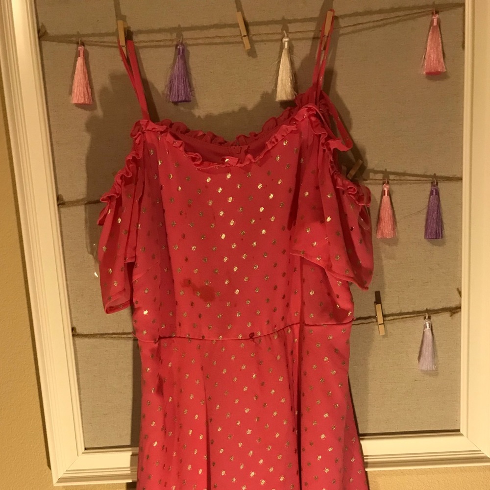 Woman’s pink and gold off-the-shoulder dress